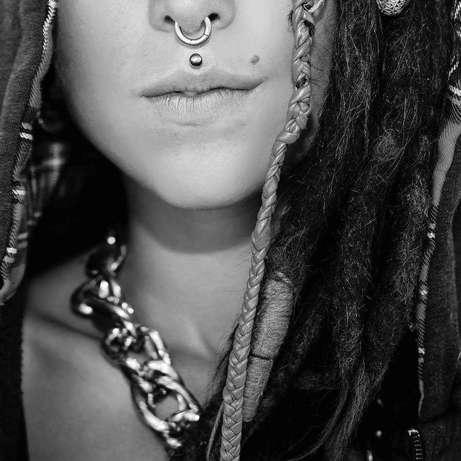 close-up-portrait-girl-with-dreadlocks-and-piercin-PHZ9N6C.jpg